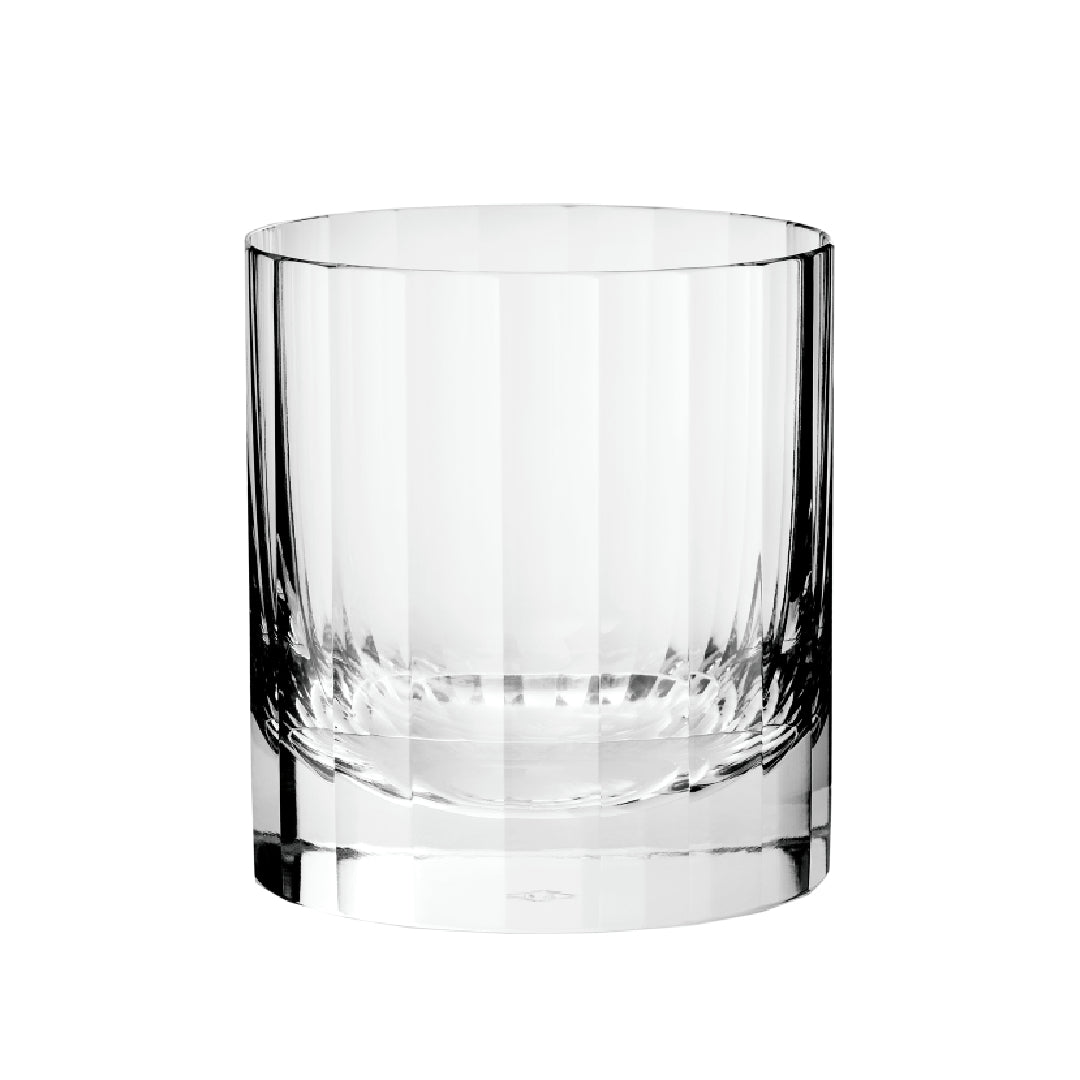 A clear glass double old fashioned tumbler with a fluted design on a white background.