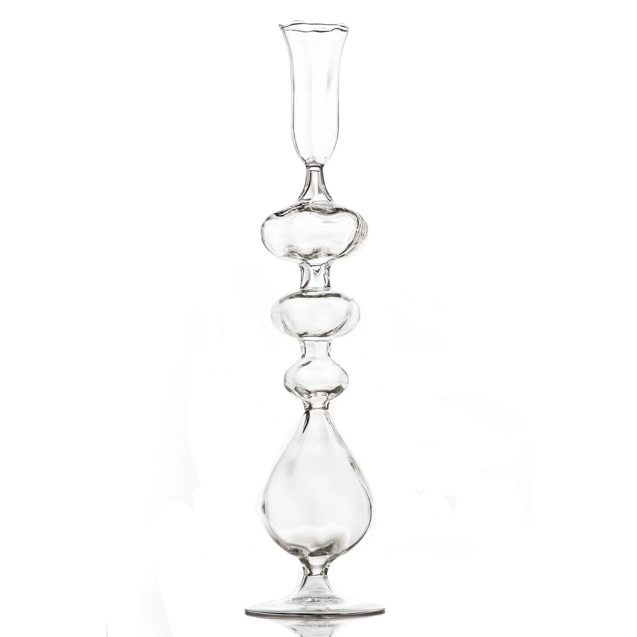 Clear glass candle holder with a unique design on a white background