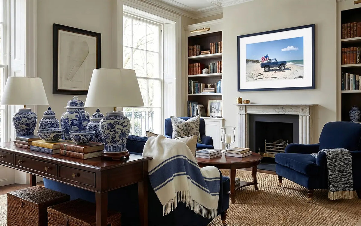 Living room with blue armchair, wooden coffee table, and bookshelves.