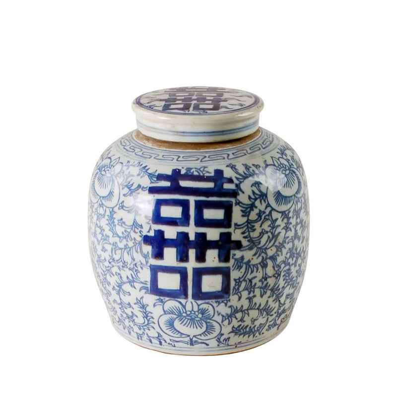Blue and white ceramic jar with floral patterns and Chinese characters on a white background
