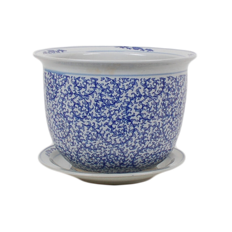 Blue and white ceramic planter with floral pattern on a white background