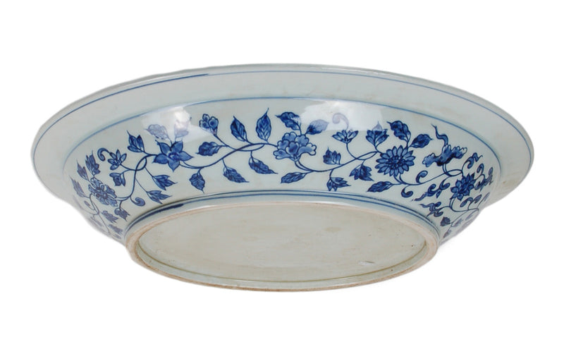 Ceramic plate with blue floral pattern on a white background