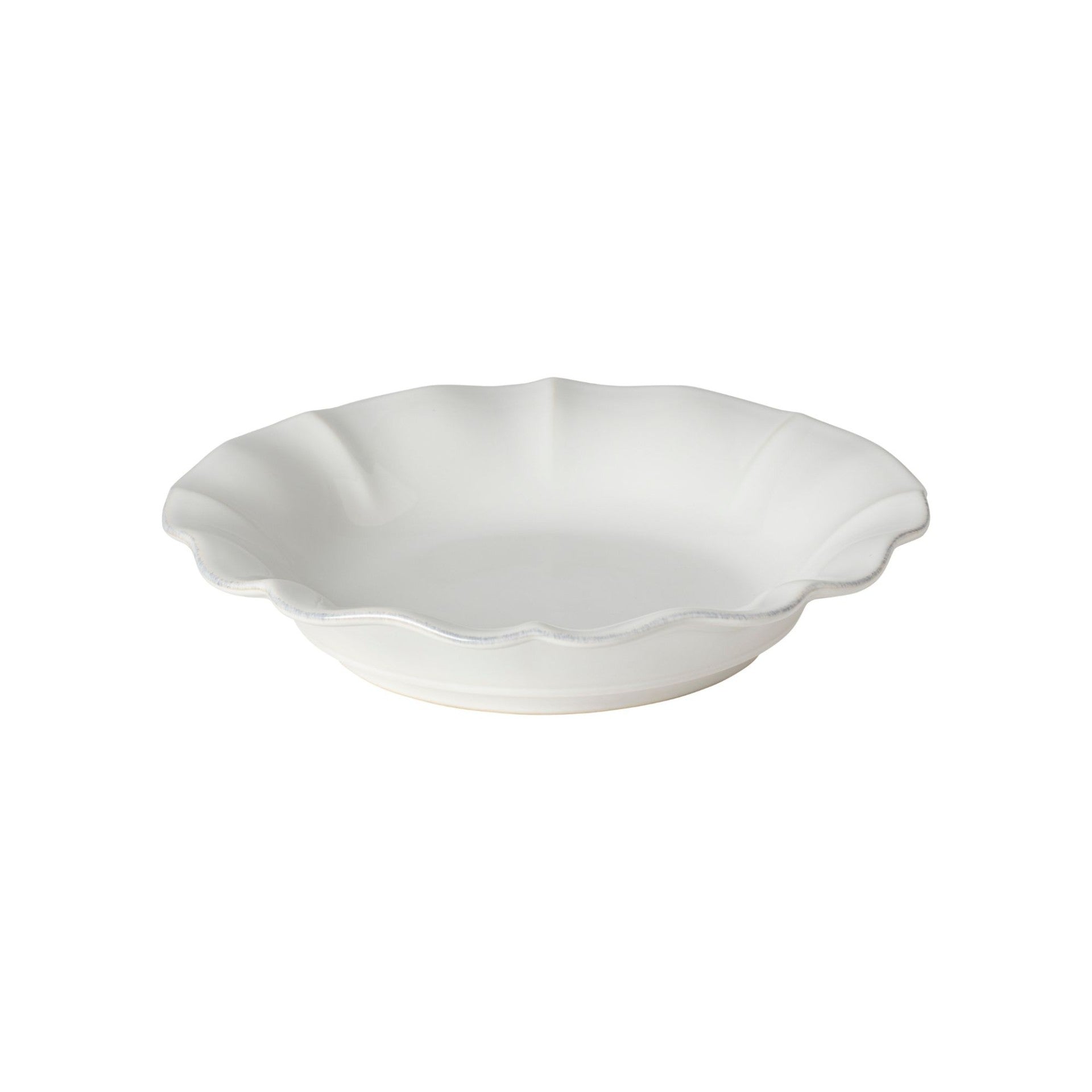 White ceramic pie dish with scalloped edge on a white background