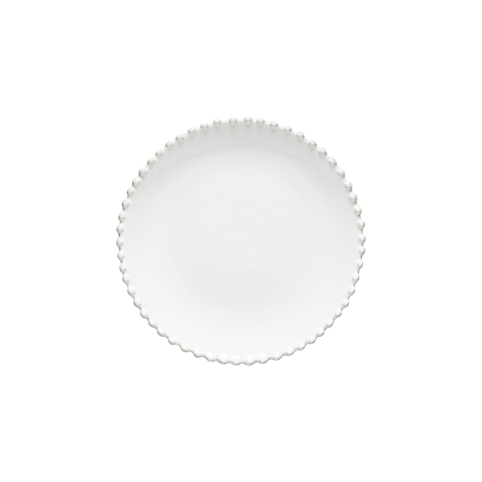 Round white plate with scalloped edge on a white background