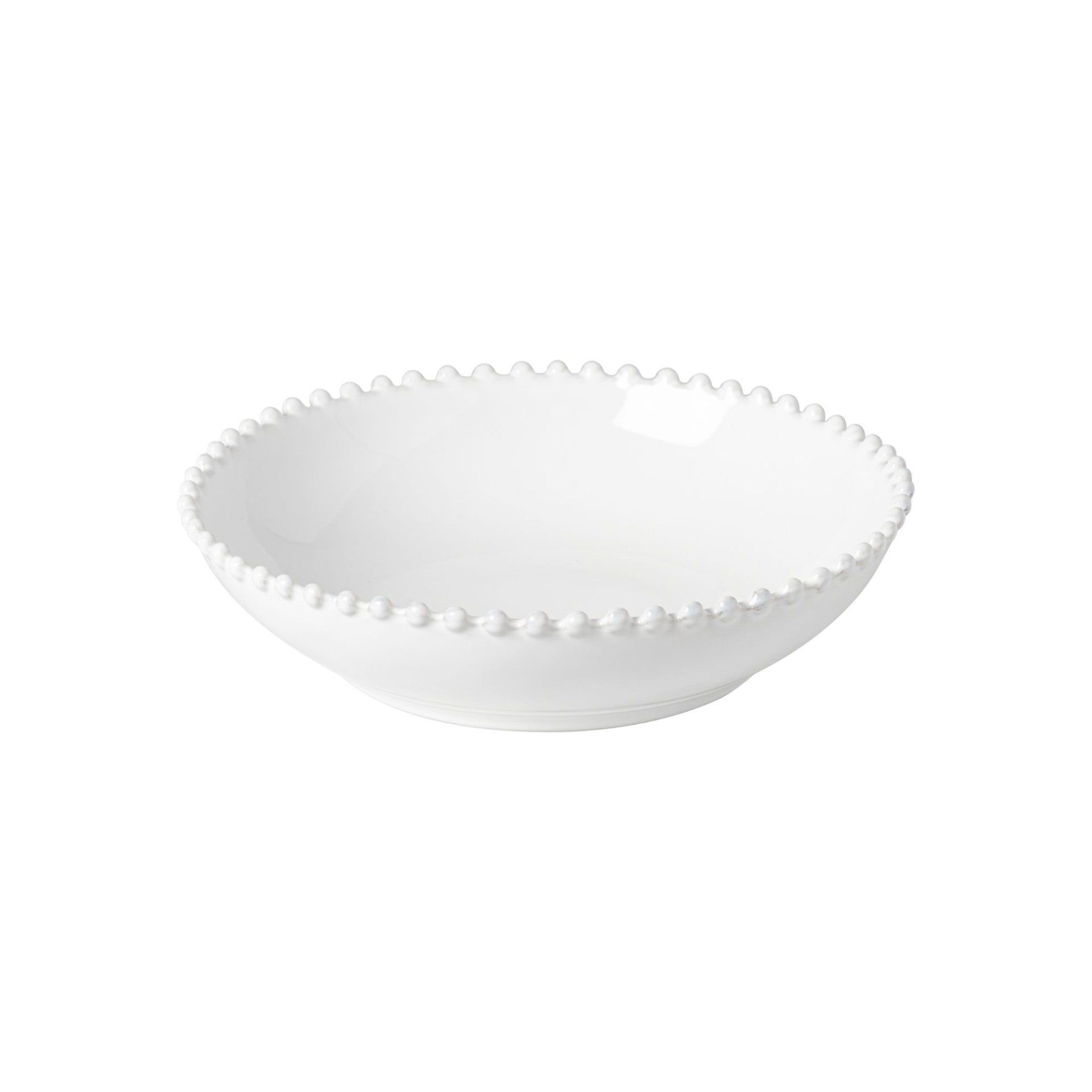 White ceramic bowl with decorative edge on a white background