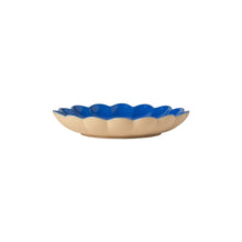 Decorative plate with blue rim on a white background