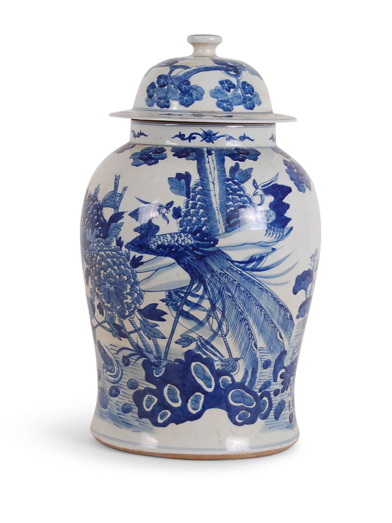White ceramic jar with blue floral and peacock design on a white background
