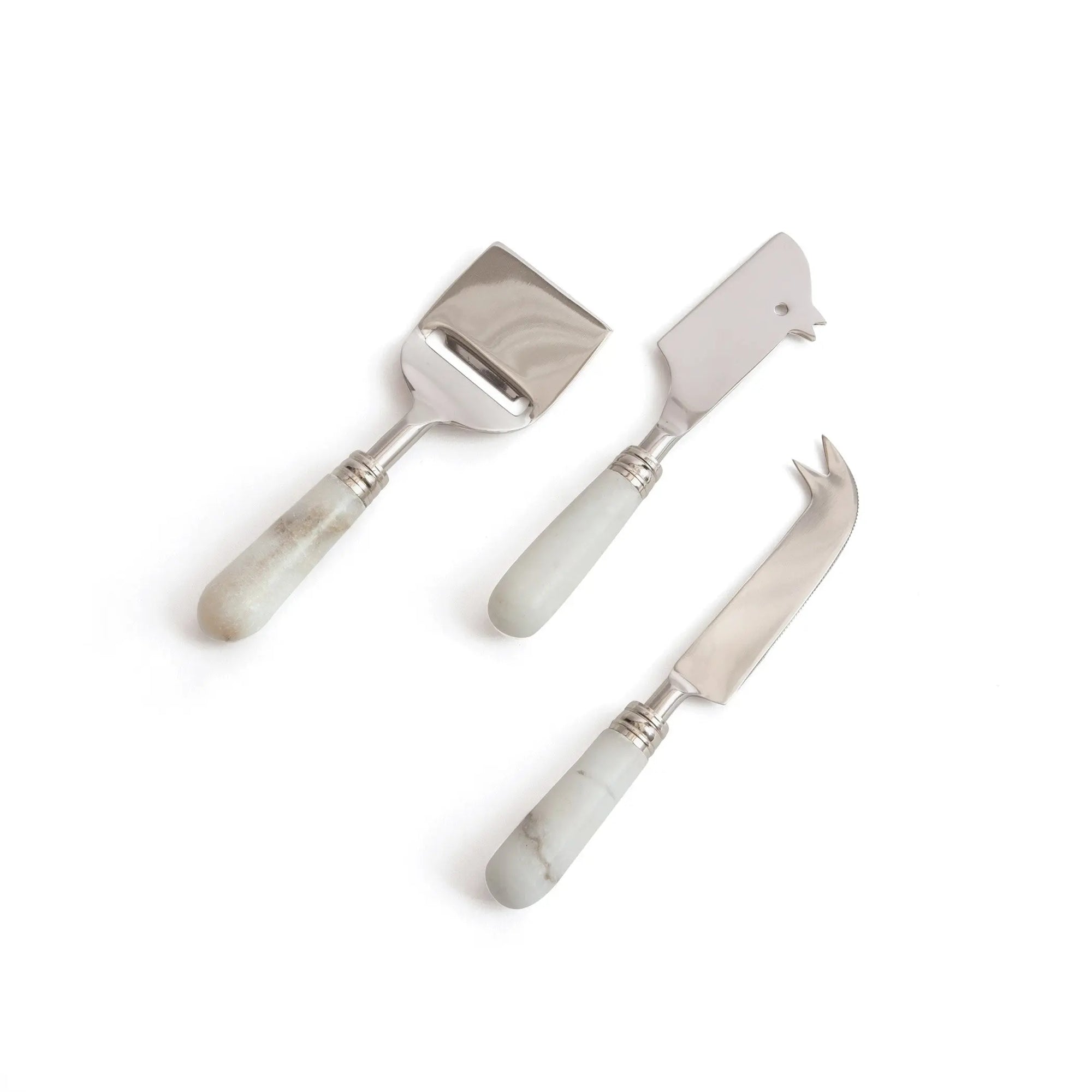 Set of three cheese tools with marble handles on a white background