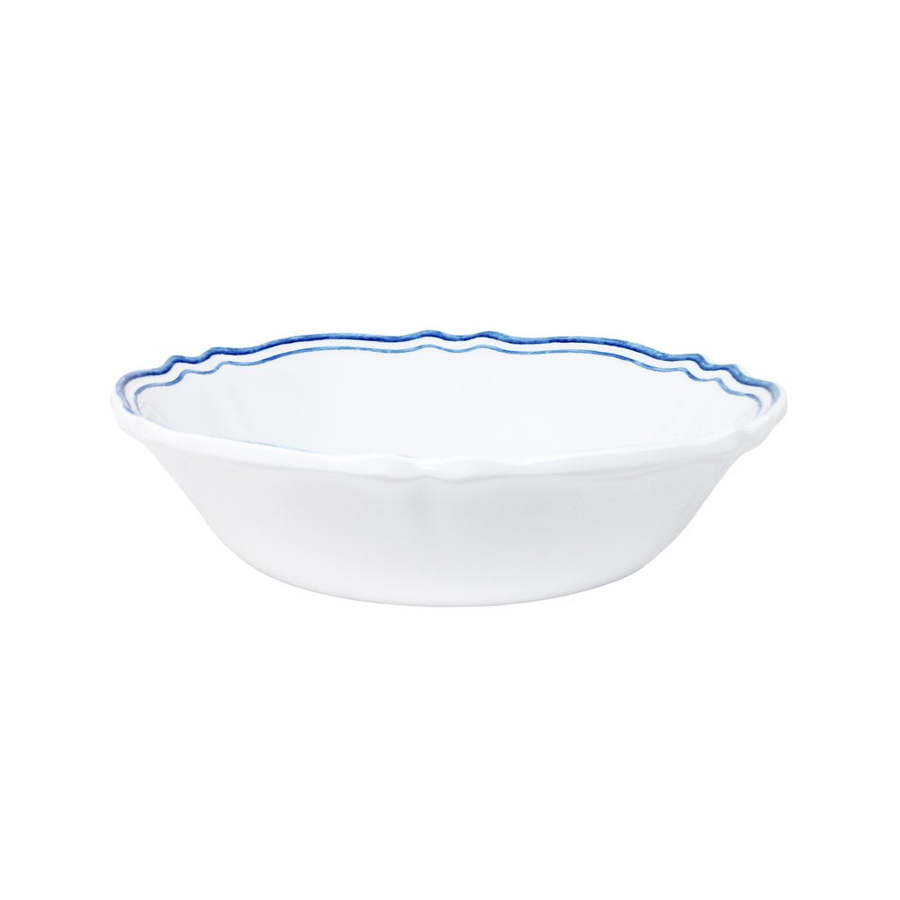 White ceramic bowl with blue rim on a white background
