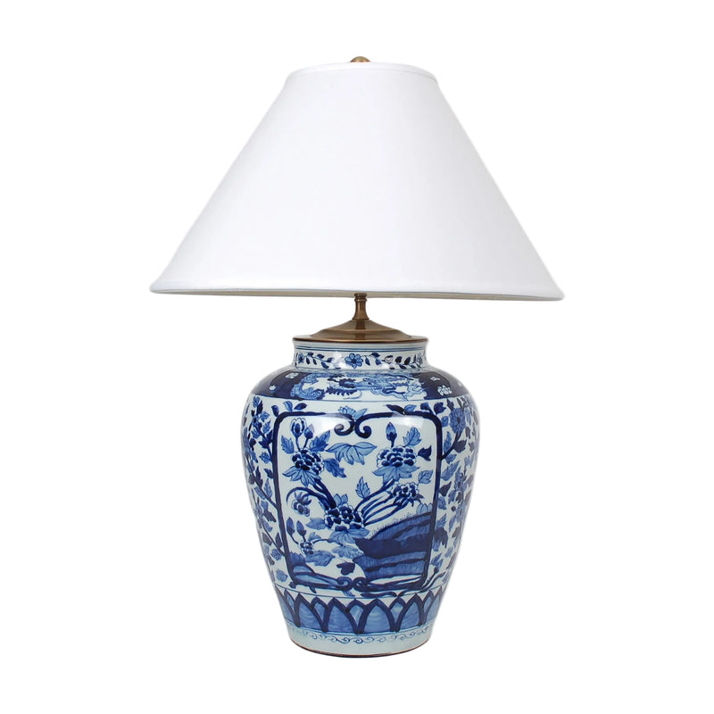 Table lamp with blue and white floral design on a white background