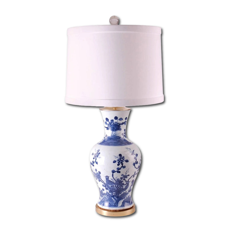 Table lamp with blue floral design on a white background