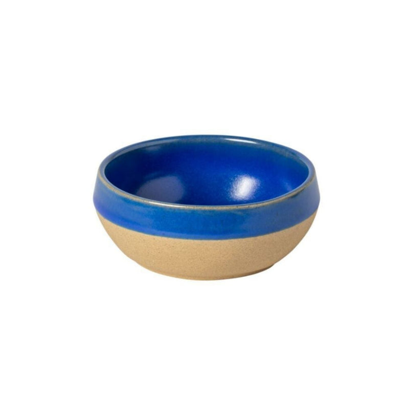 A ceramic bowl with a blue interior and beige exterior, designed as a serving bowl.