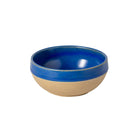 A blue ceramic fruit bowl with a beige rim.