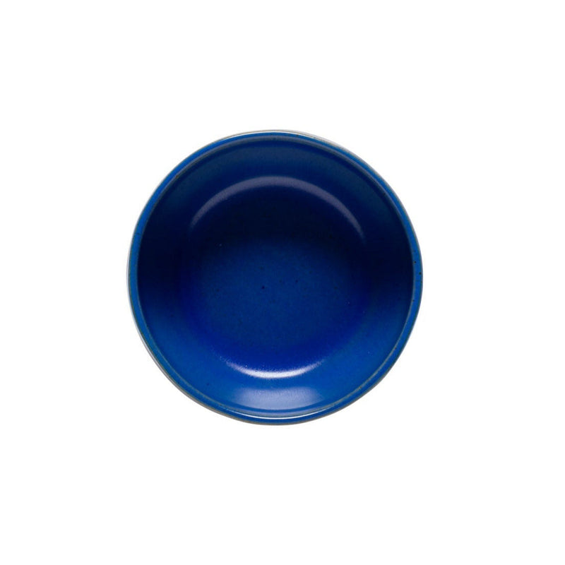 A blue ceramic fruit bowl with a beige rim seen from top.