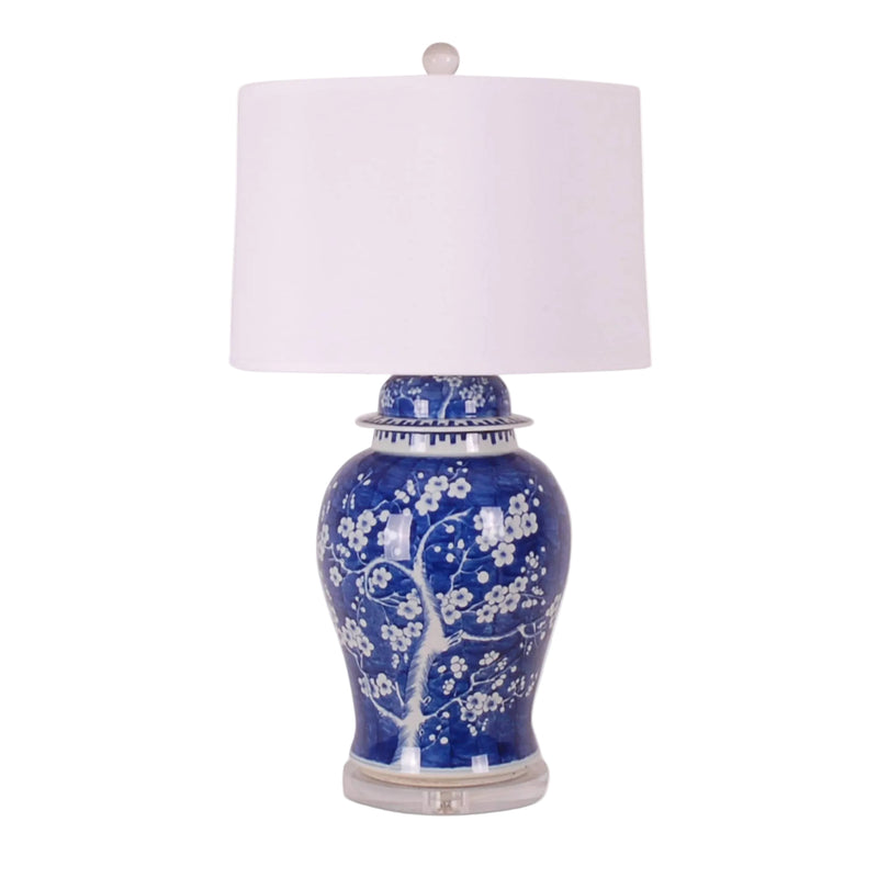 Decorative lamp with blue floral design on a white background