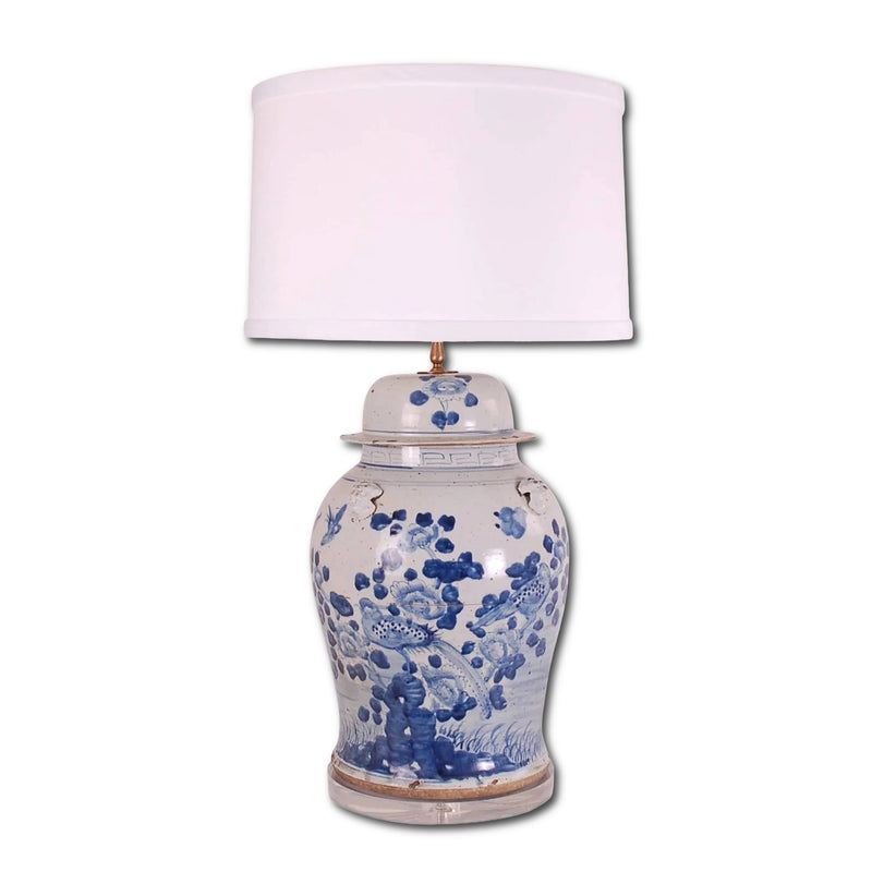 Decorative lamp with blue floral patterns on a white background