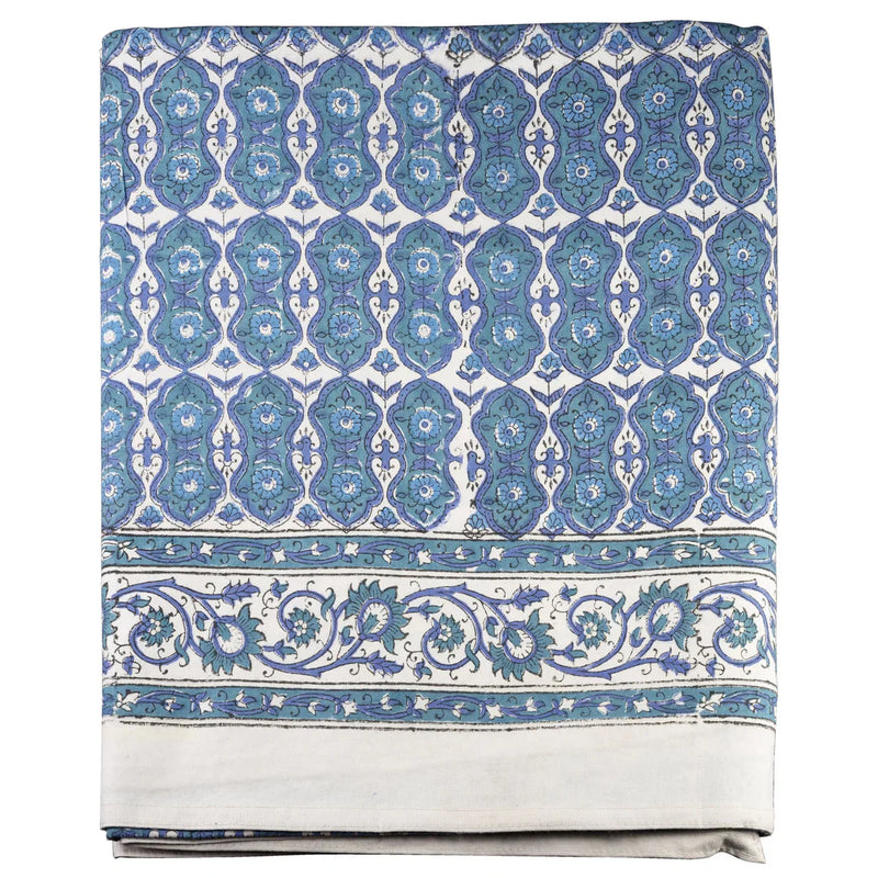 Paisley patterned fabric with multi-color blue design on a white background