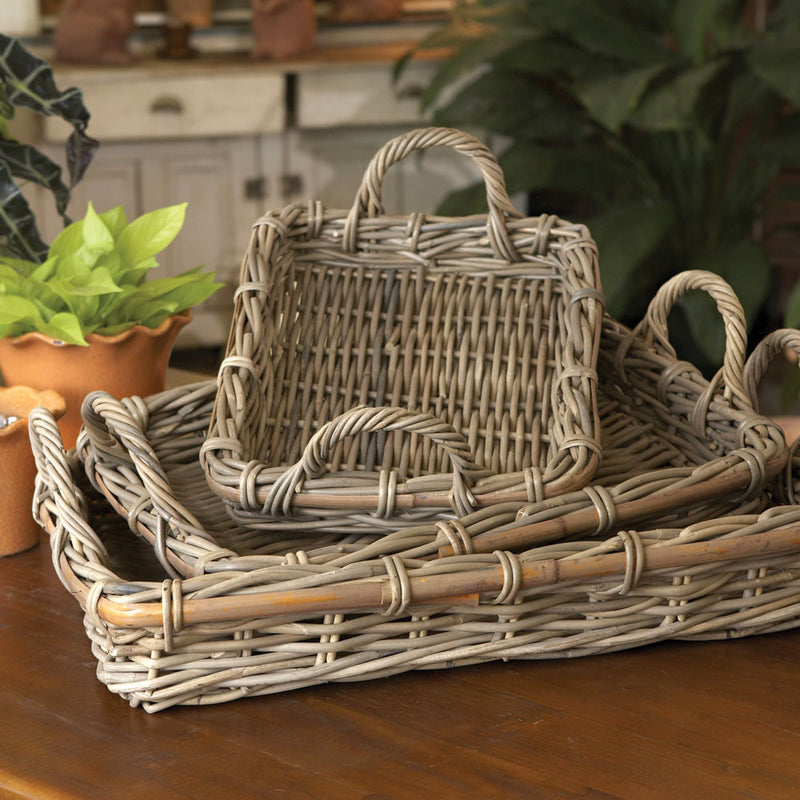 Set of 3 woven baskets (small, medium, large) with handles on a wooden table