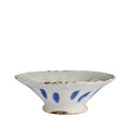 White ceramic bowl with blue accents on a white background
