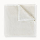 White textured blanket on a white background