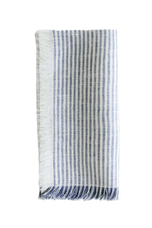 Linen fringe napkin with thin blue and white stripes on white background