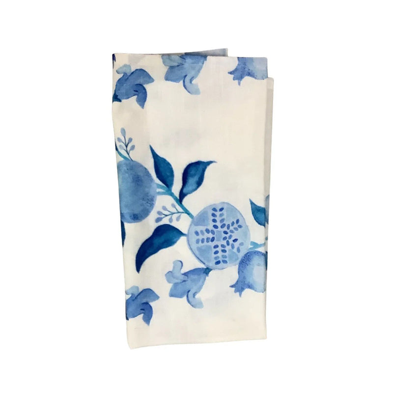 Folded fabric with blue floral pattern on a white background