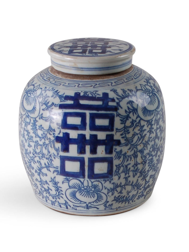 Blue and white ceramic jar with 'double happiness' symbol on a white background