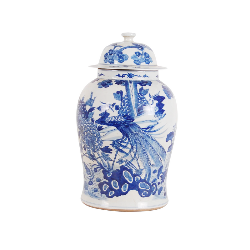 Blue and white ceramic jar with floral design on a white background