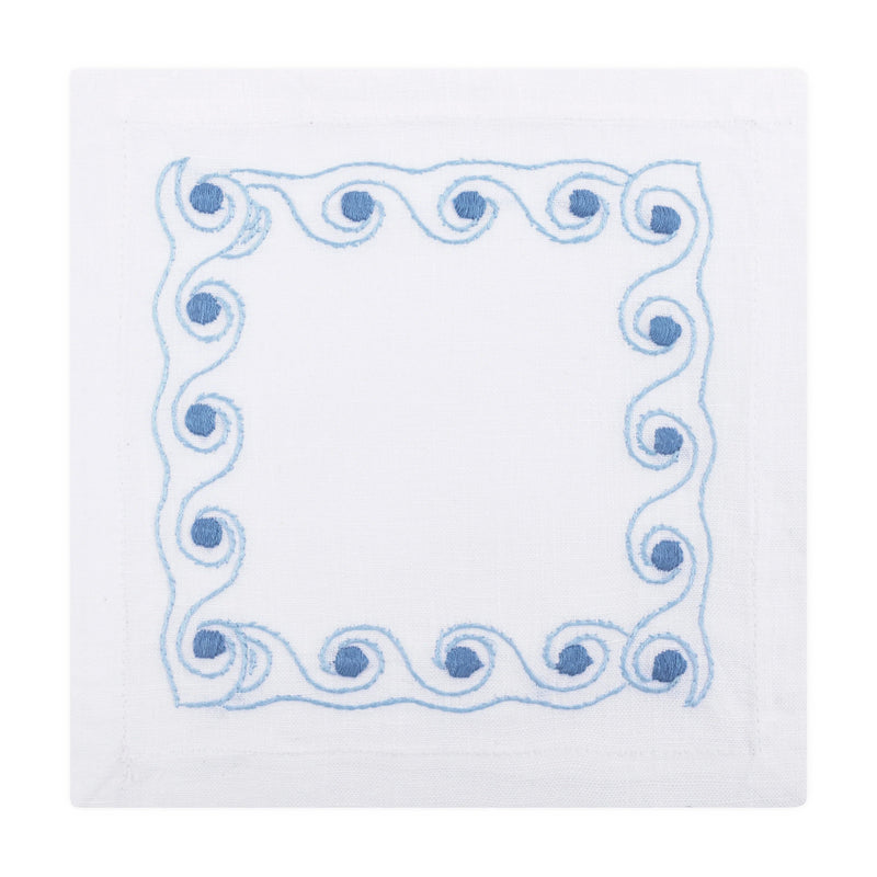 White napkin with blue decorative border on a white background