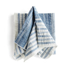 Set of blue and white striped towels on a white background