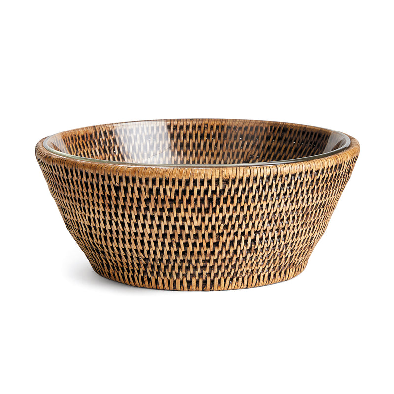 Rattan serving bowl with glass insert on white background