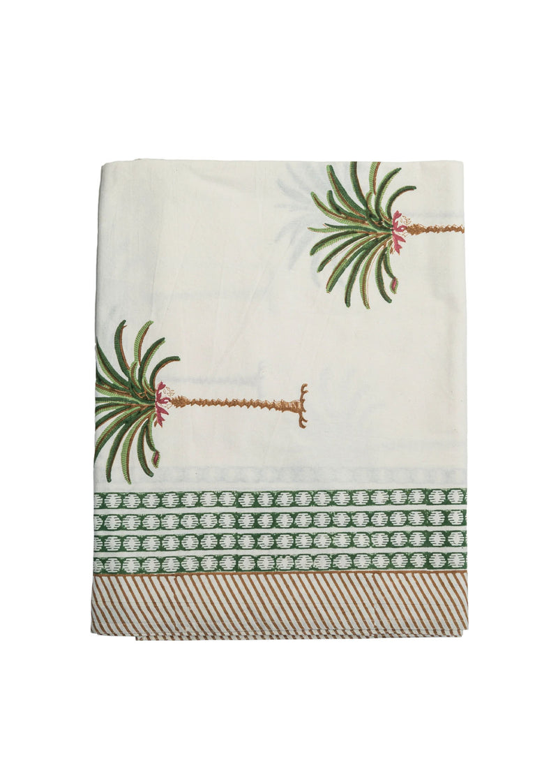Decorative blanket with palm tree design on a white background