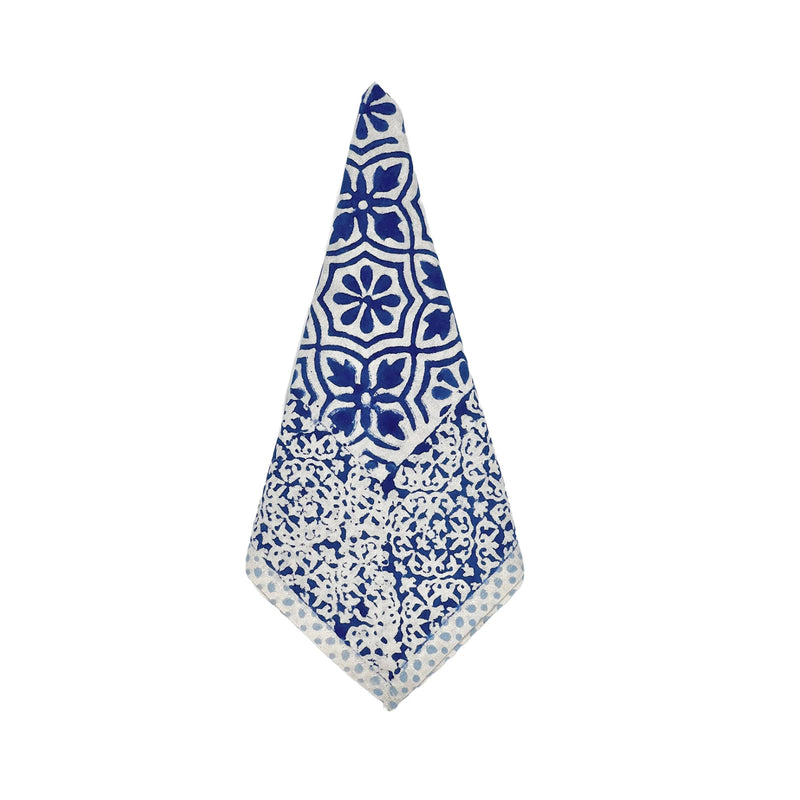 Blue and white patterned napkin on a white background