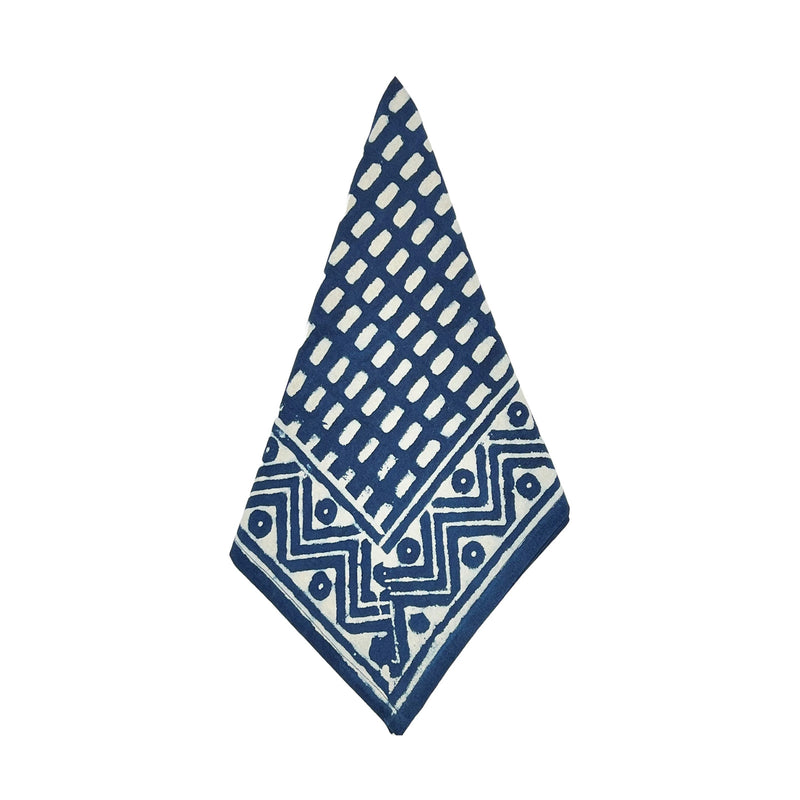 Napkin with geometric blue and white pattern on a white background