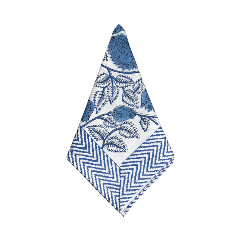 Napkin with blue floral and zigzag pattern on a white background