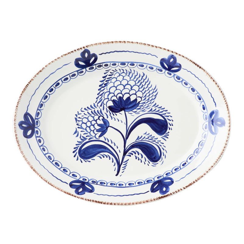 Decorative plate with blue floral design on a white background