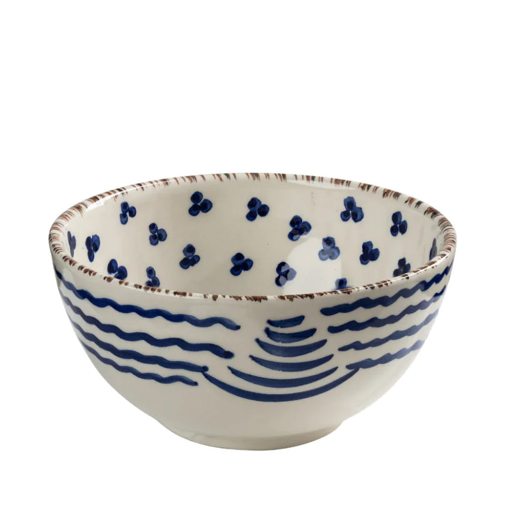 Ceramic bowl with blue wave design on a white background