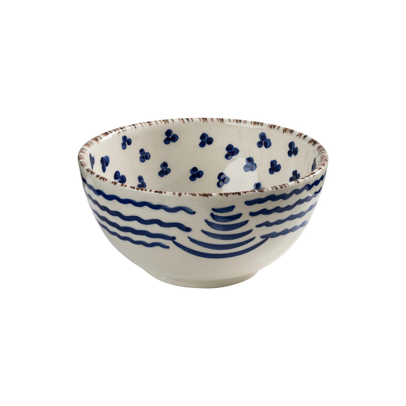Ceramic bowl with blue wave design on a white background