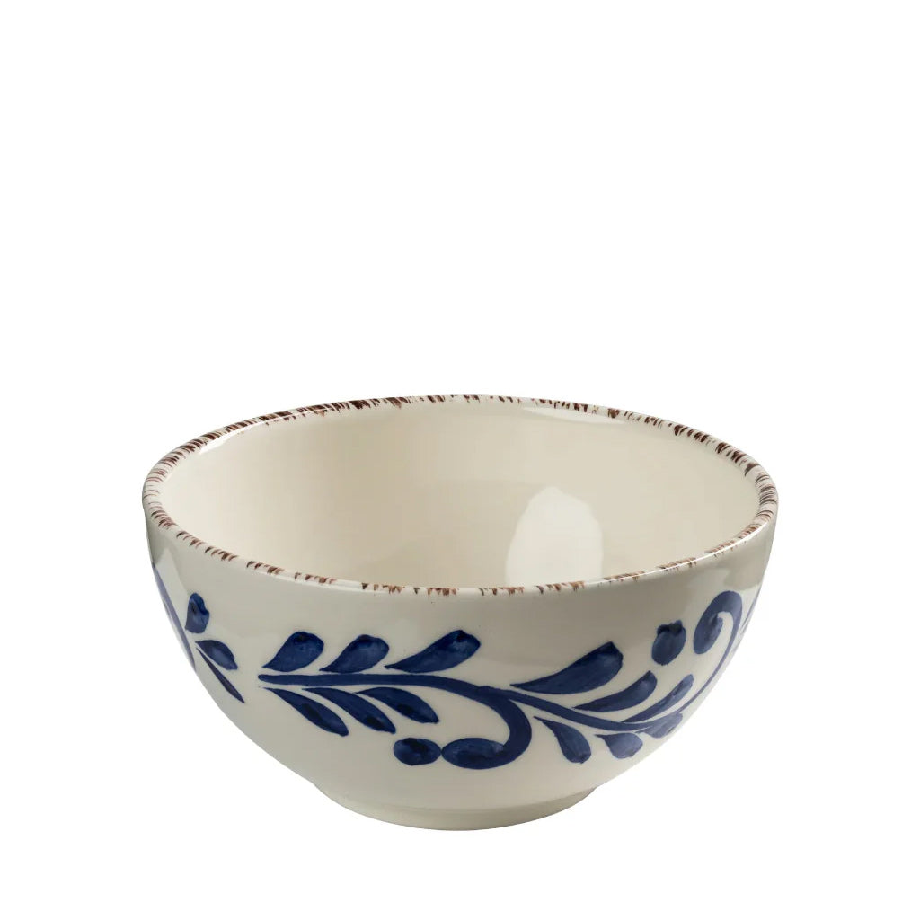 Ceramic bowl with blue leaf design on a white background