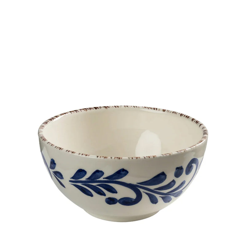 Ceramic bowl with blue leaf design on a white background