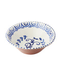 Ceramic bowl with blue floral pattern on a white background