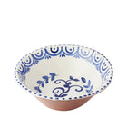 Ceramic bowl with blue decorative patterns on a white background