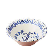 Ceramic bowl with blue decorative patterns on a white background