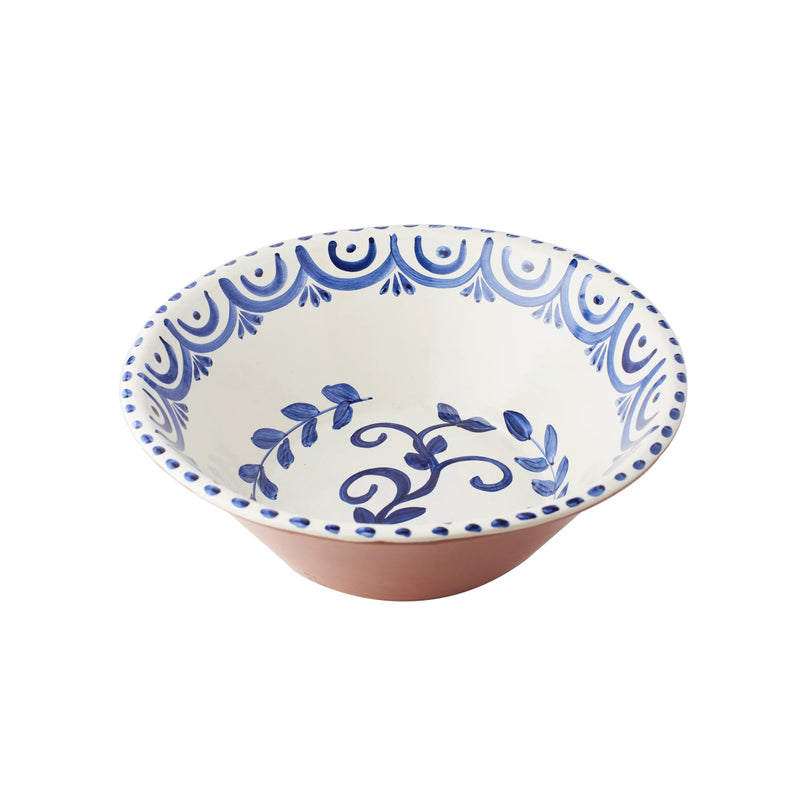 Ceramic bowl with blue decorative patterns on a white background