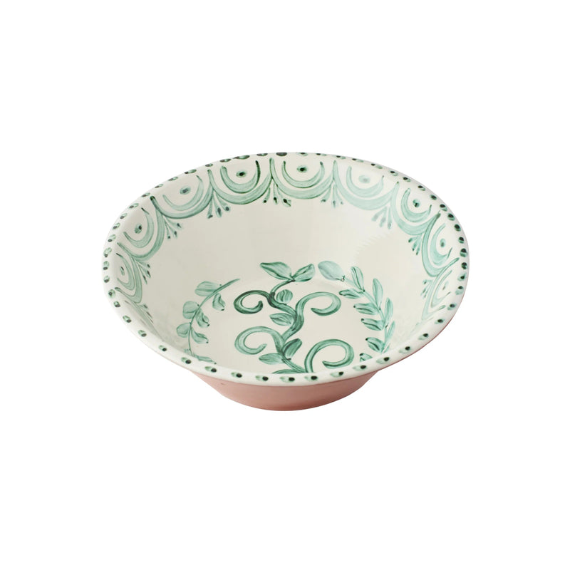 Decorative ceramic bowl with green floral pattern on a white background