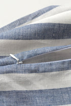Close up photo of blue & white linen pillow with zipper