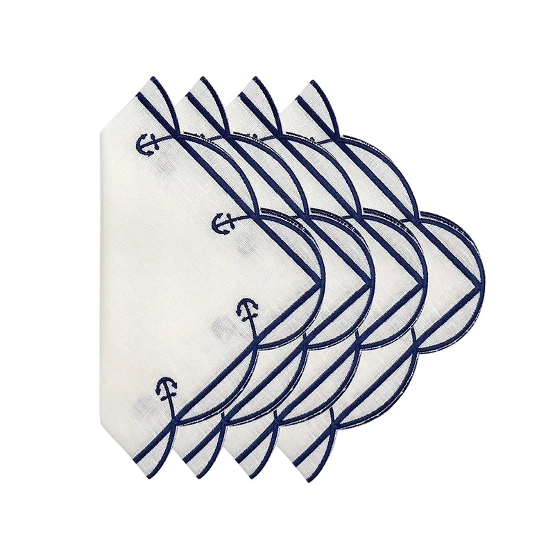 Set of white napkins with blue anchor patterns on a white background