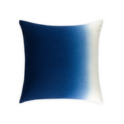 Decorative pillow with blue and white gradient on a white background