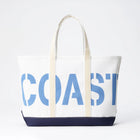 Tote bag with 'COAST' printed on it against a white background