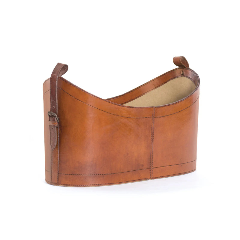 Brown leather magazine holder on a white background